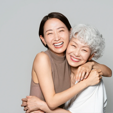 Two women embracing warmly